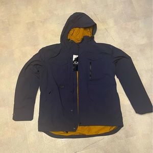 Oakley navy blue shell coat. Water resistant hooded jacket. NWT